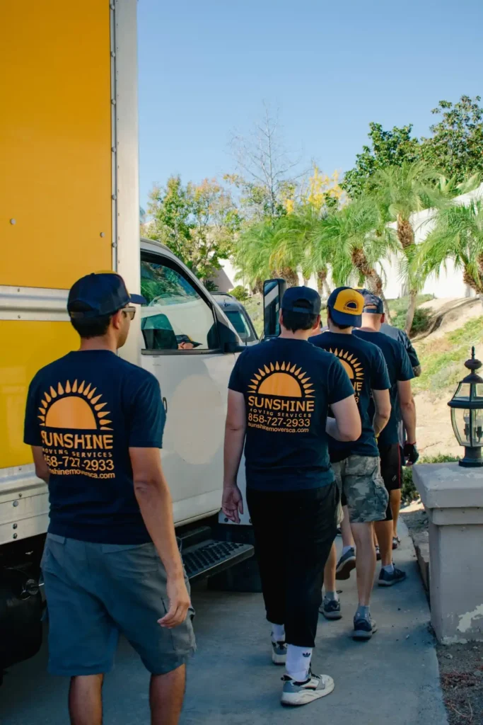 Sunshine Moving Services crew walking to a job