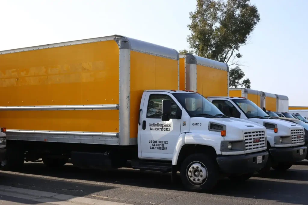 Row of Sunshine Moving Services trucks
